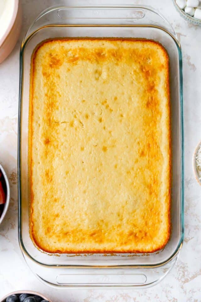 Baked yellow cake in a 9x13-inch pan.