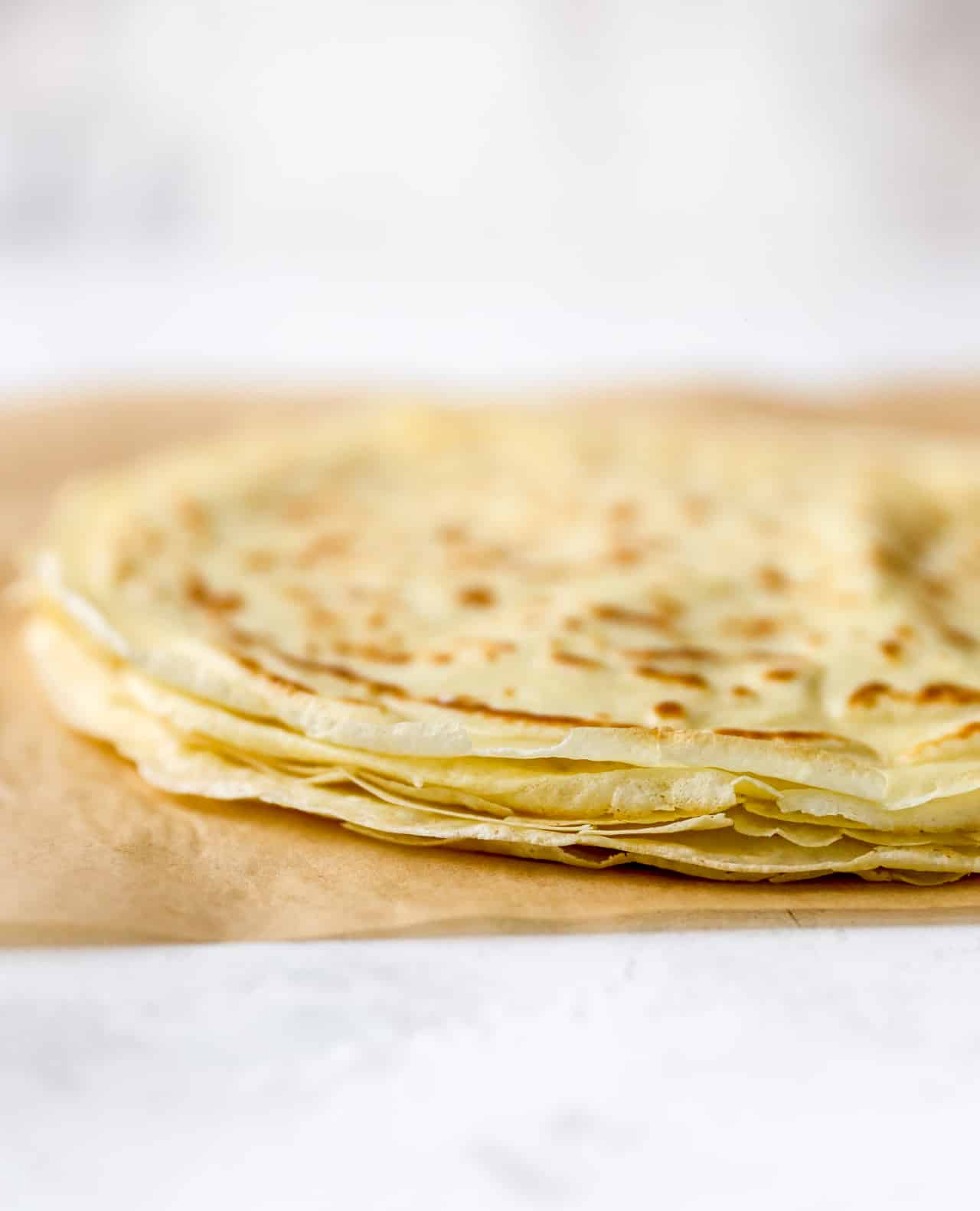 Thin crepes on a counter.