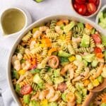 Rotini pasta with shrimp, veggies and avocado.