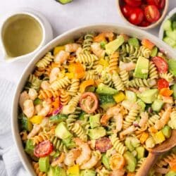 Rotini pasta with shrimp, veggies and avocado.