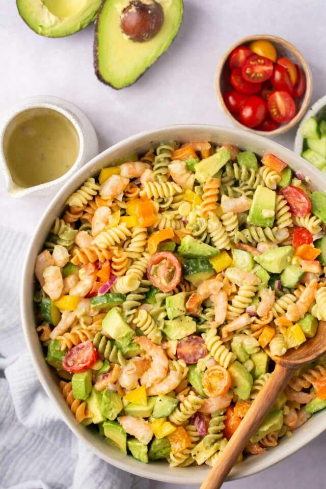 Rotini pasta with shrimp, veggies and avocado.