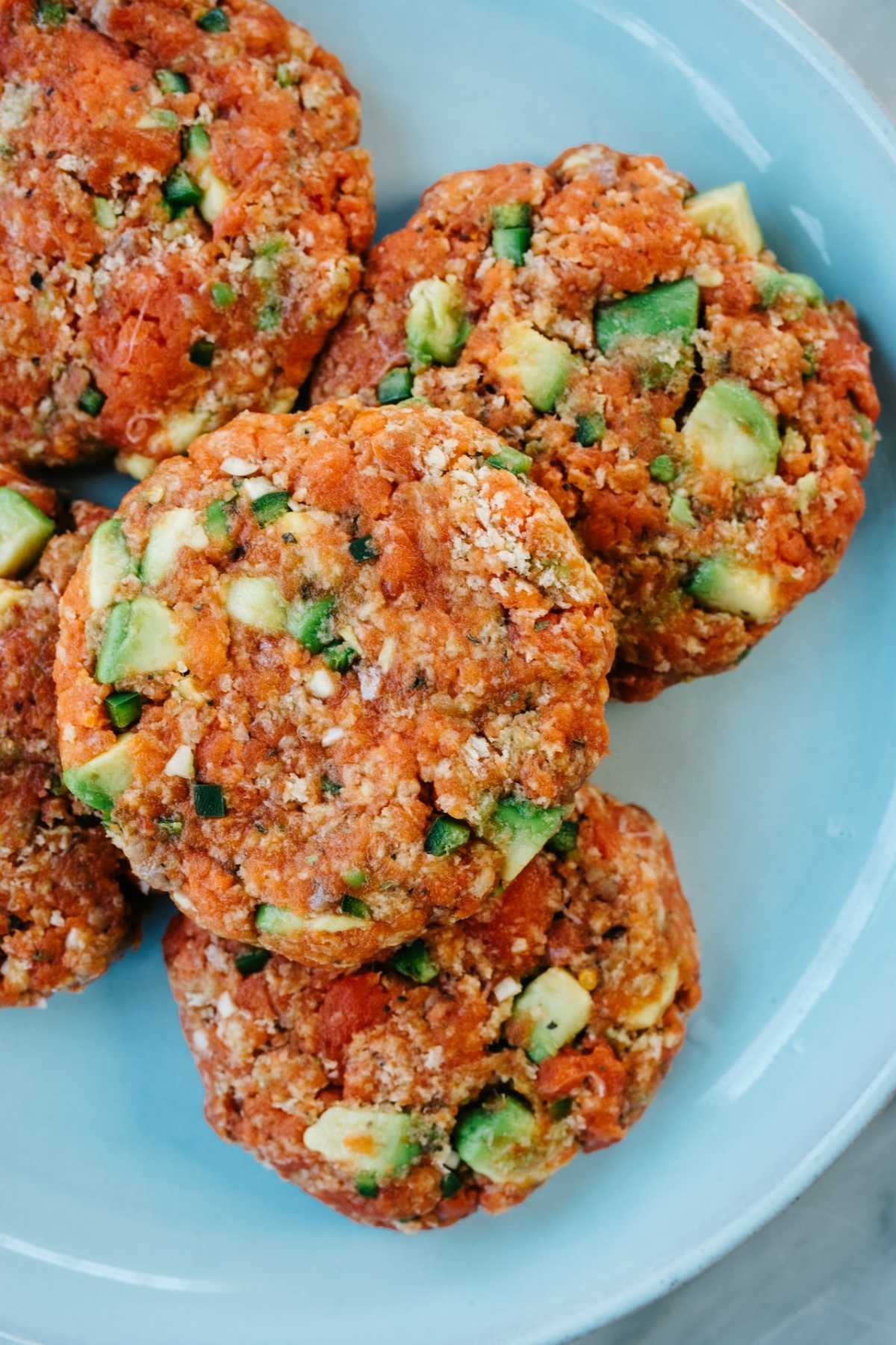 Raw salmon patties with avocado.