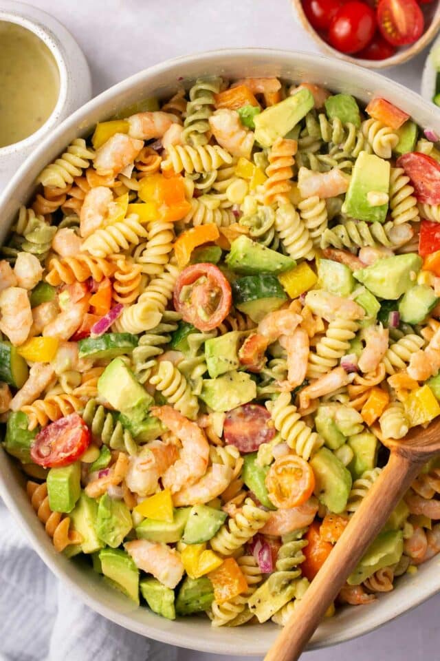 Pasta salad with shrimp, avocado and veggies.