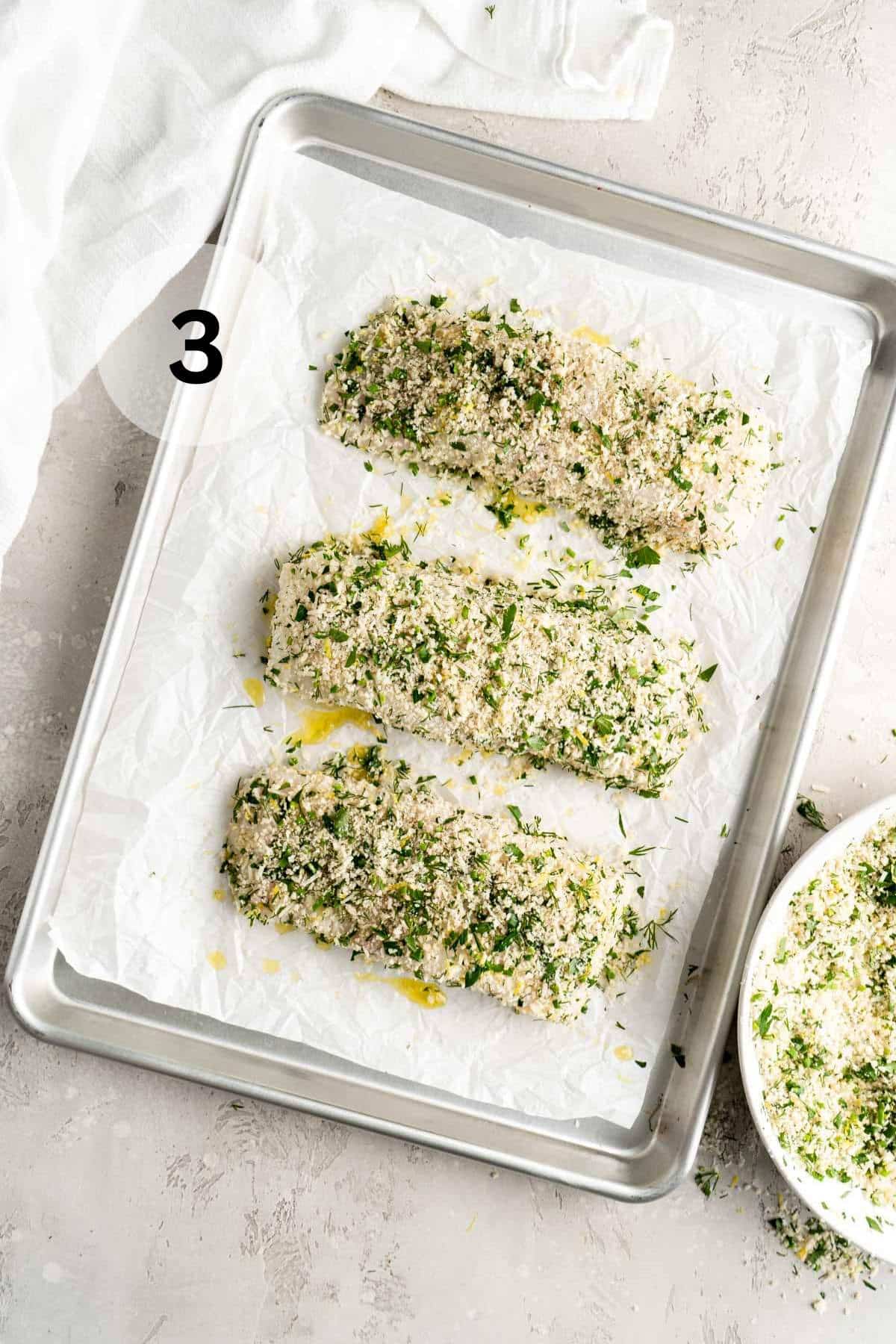 Halibut fillets coated in breadcrumbs and fresh herbs.
