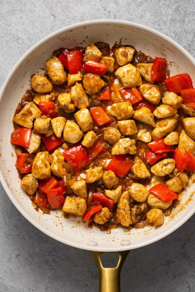Kung pao chicken in a skillet.