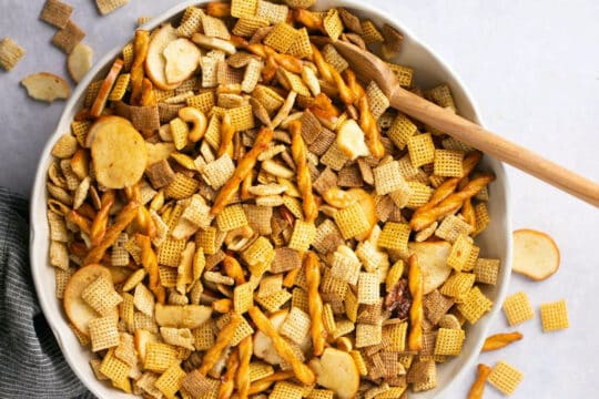 Pour melted butter over Chex mix.