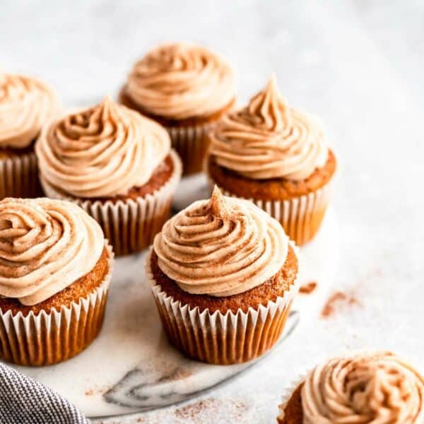 Pumpkin cupcakes with cinnamon cream cheese frosting.