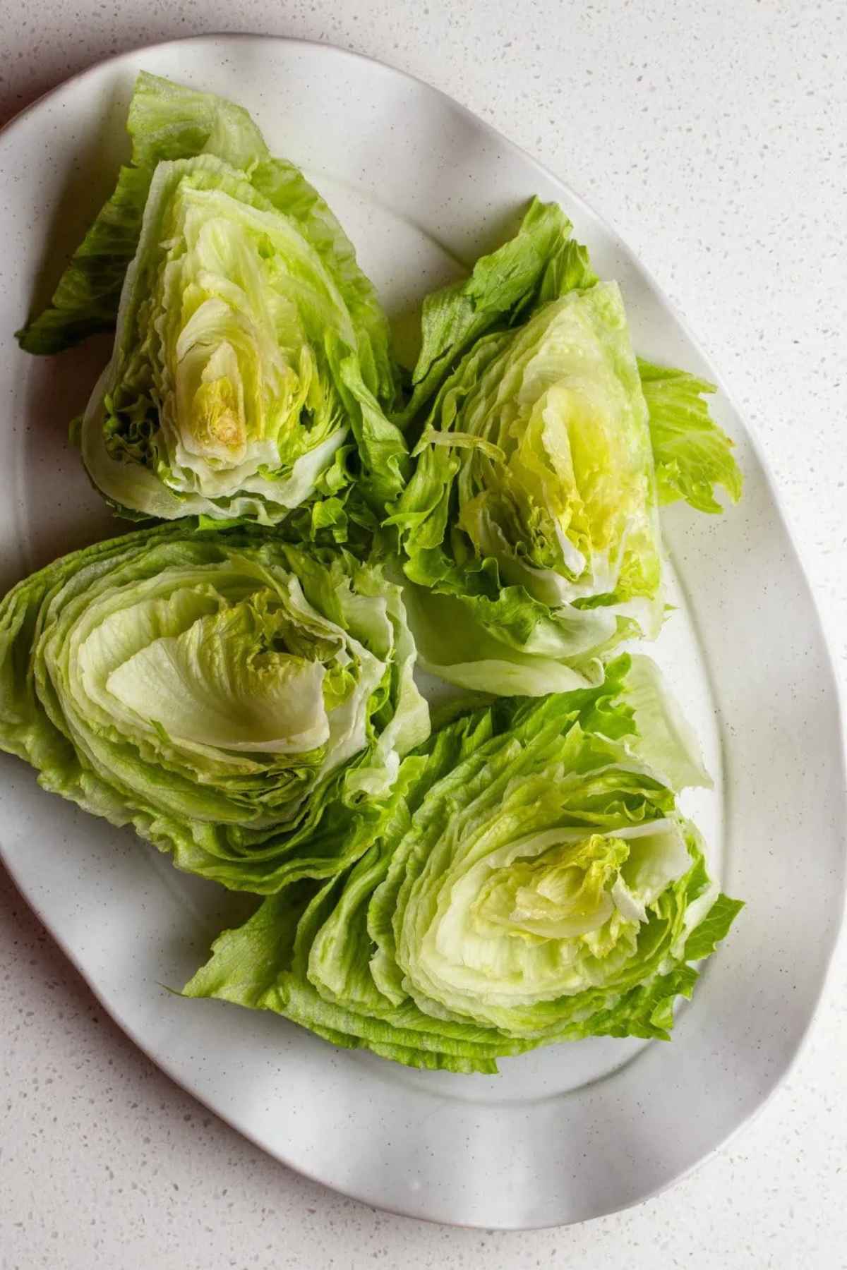 Head of lettuce cut into 4 wedges.