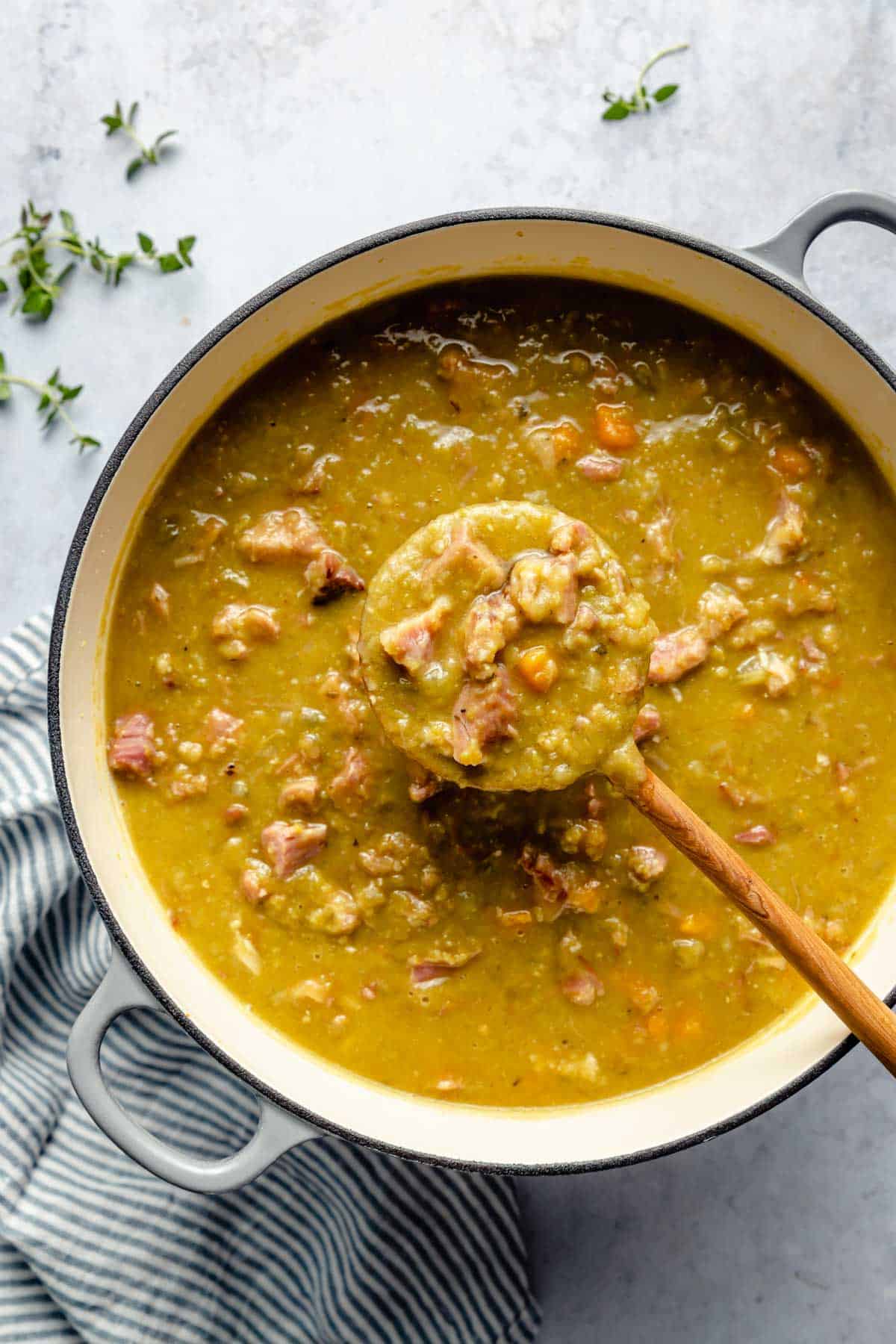 Cooking soup in a large pot.