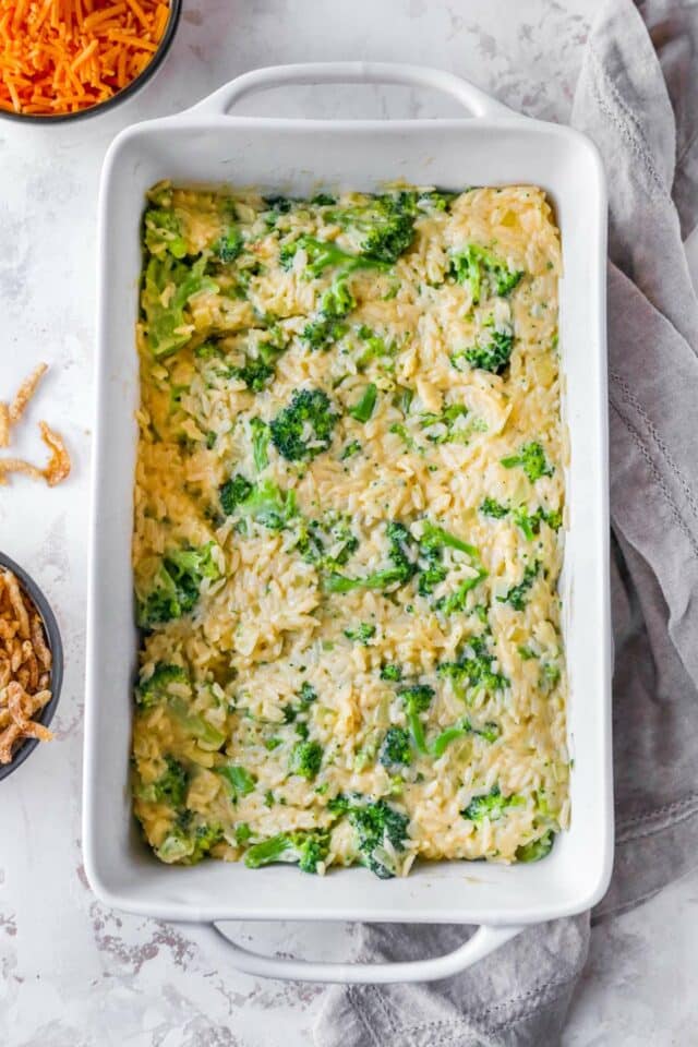 Broccoli, rice and cheese mixture in a casserole dish.