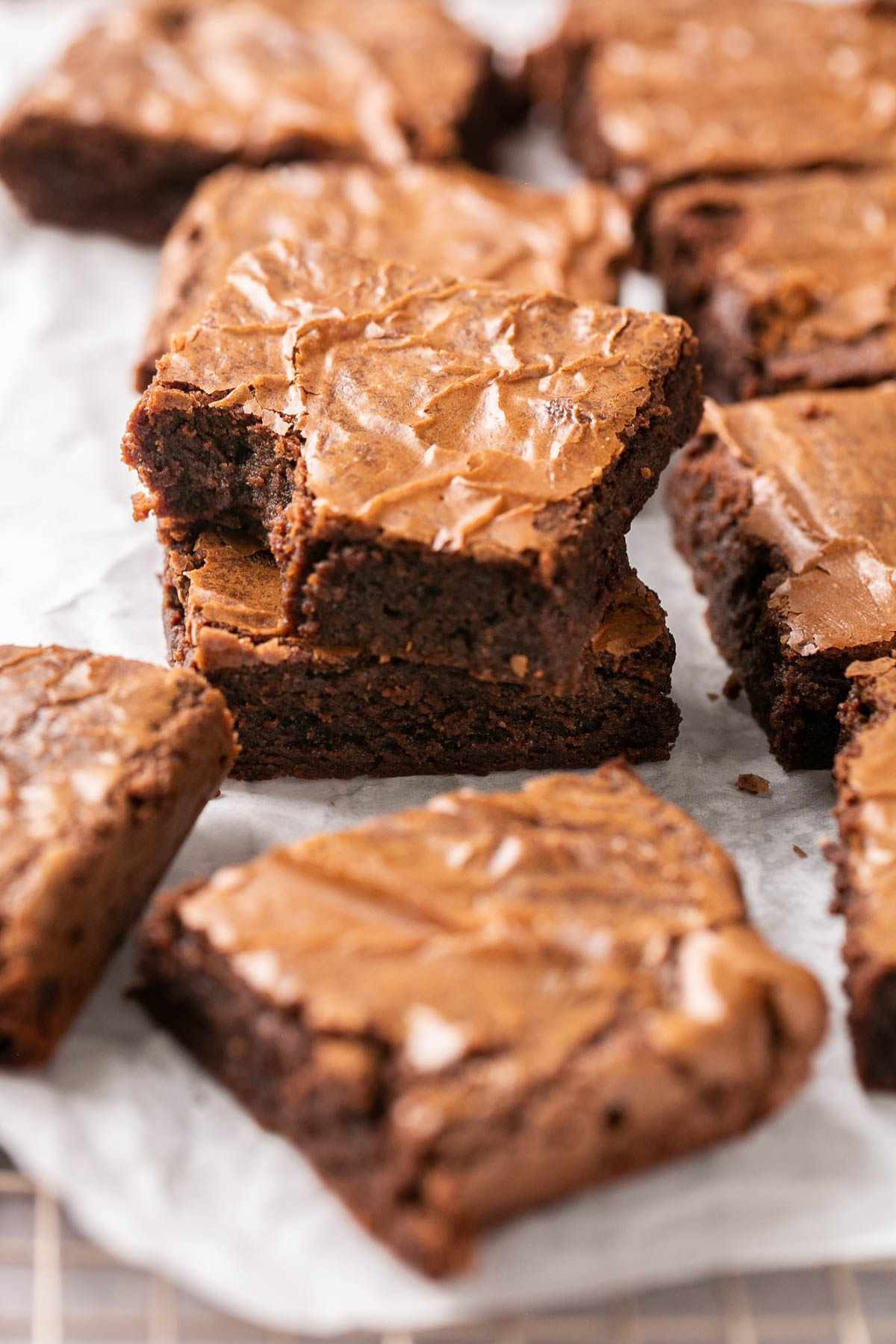 One brownie with a bite taken out, stacked on another.
