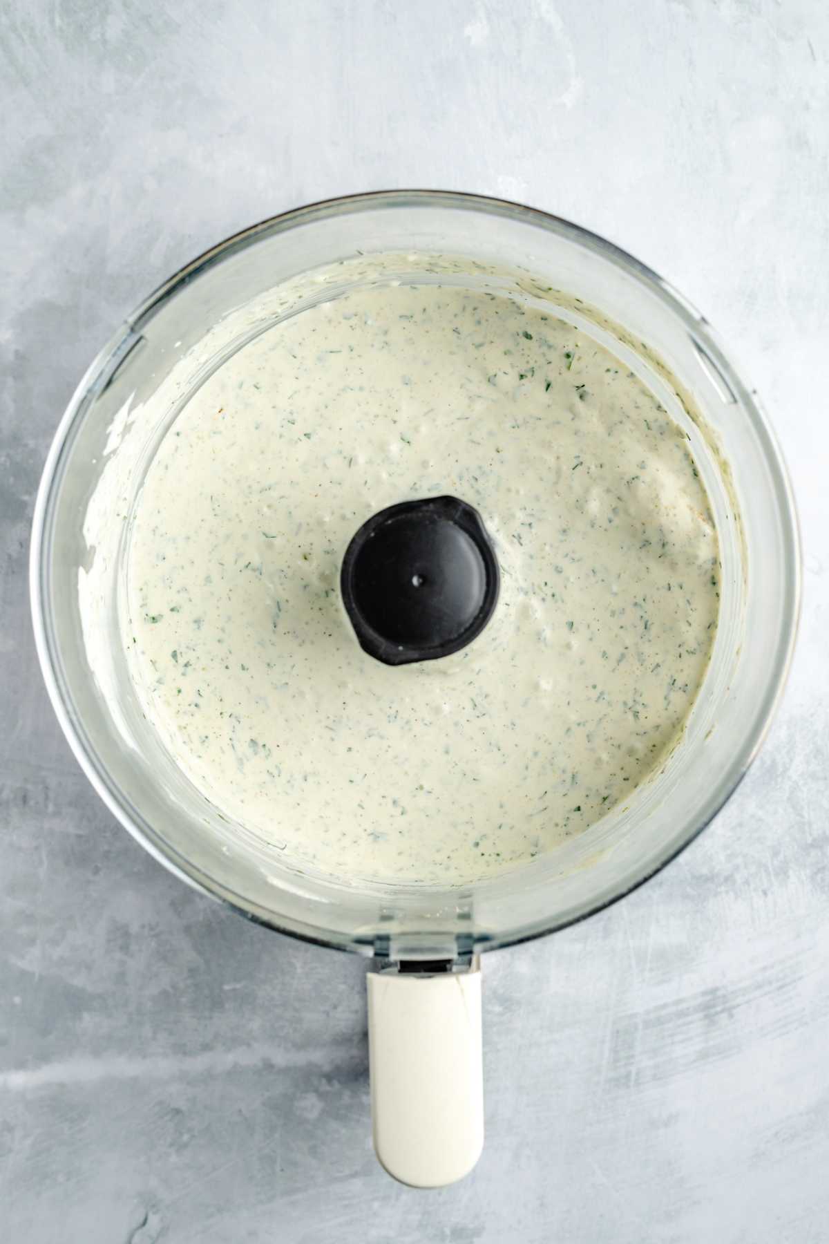 Blended cream cheese dip in a food processor.