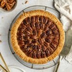 Pecan pie on a wire rack.