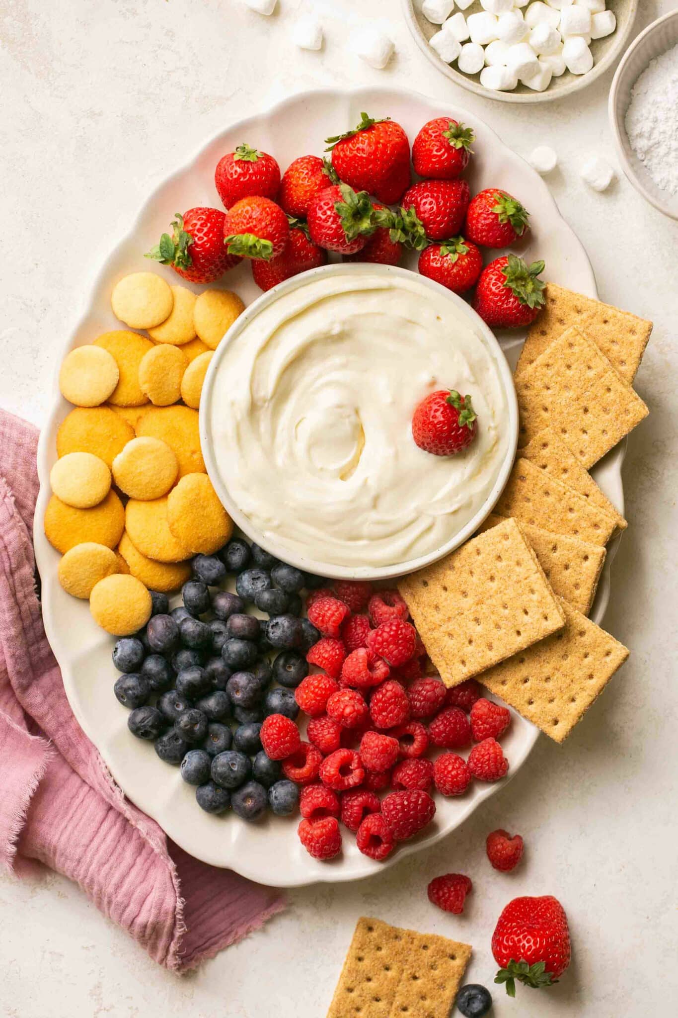 Fruit dip on a white serving platter.