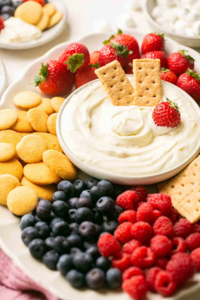 Creamy dessert dip with fruit and cookies.