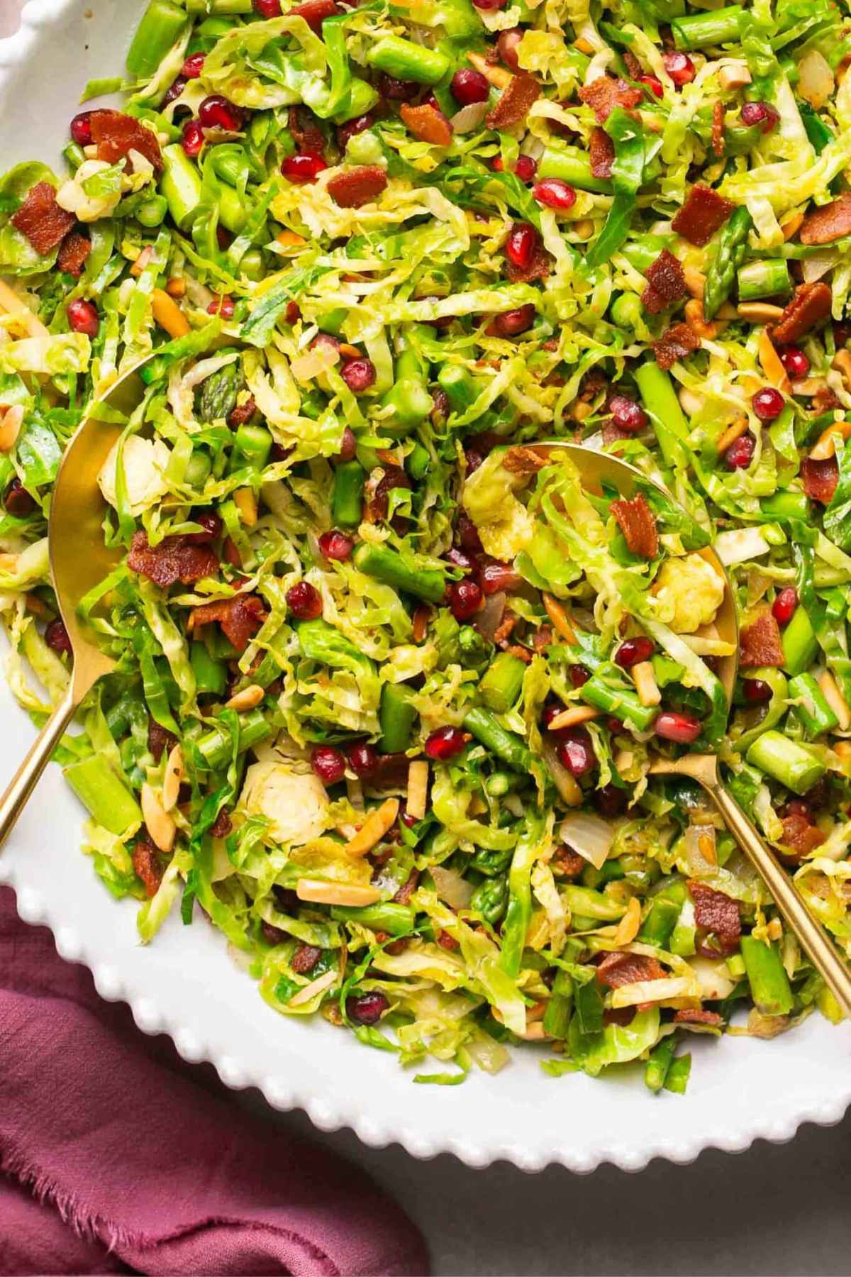 Brussel sprout salad served on a large white platter.