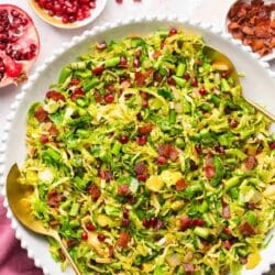 Salad made with Brussel sprouts, bacon, asparagus and pomegranate seeds.