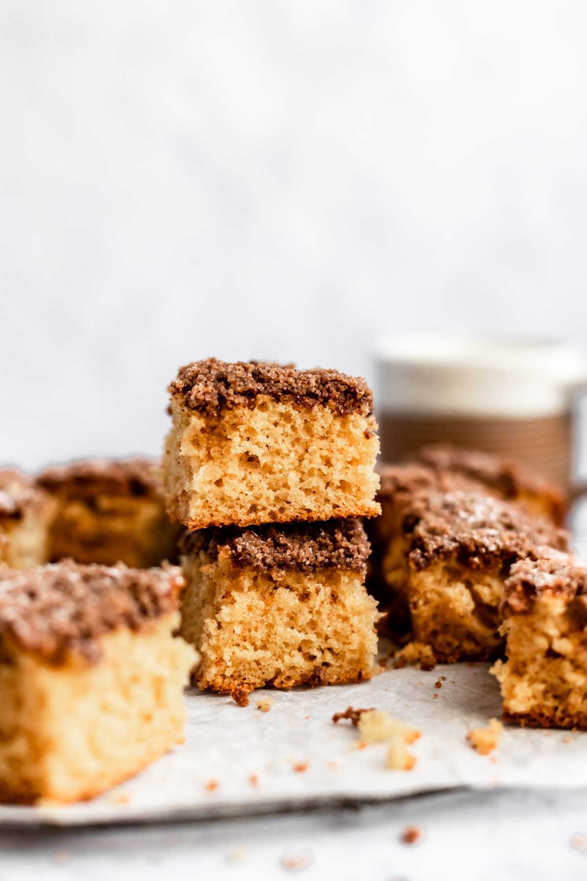 Two pieces of cinnamon crumb cake stacked.