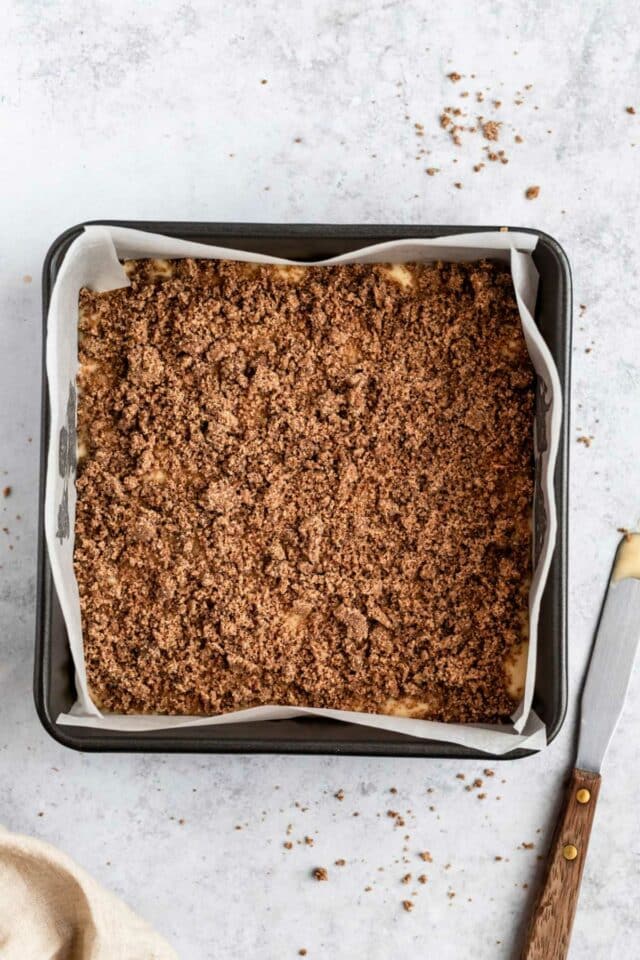Cinnamon butter mixture sprinkled over batter in pan.