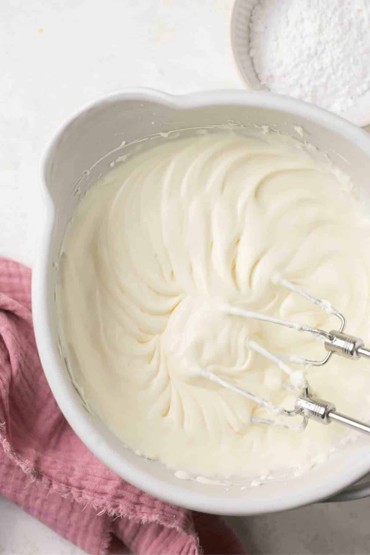 Whipping heavy whipping cream with cream cheese.