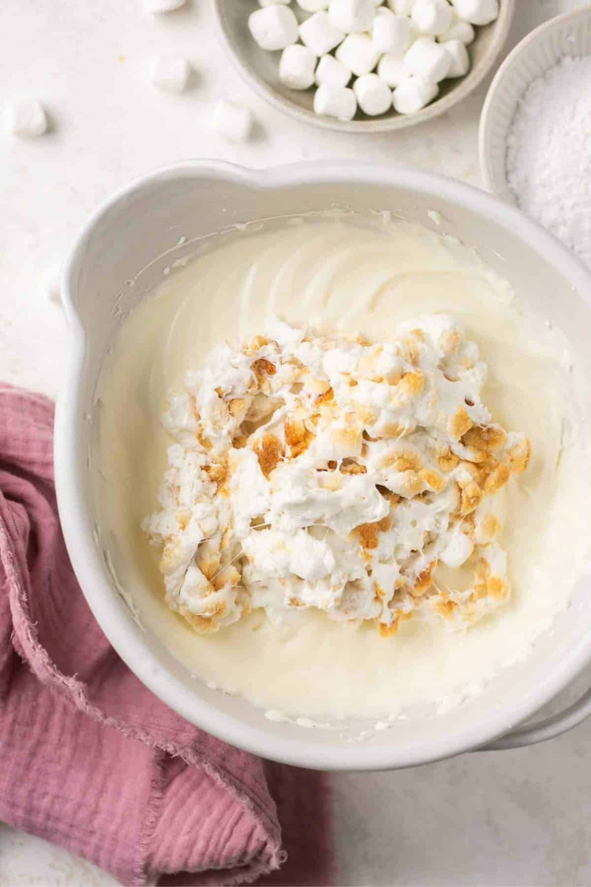 Mixing toasted marshmallows into dip.