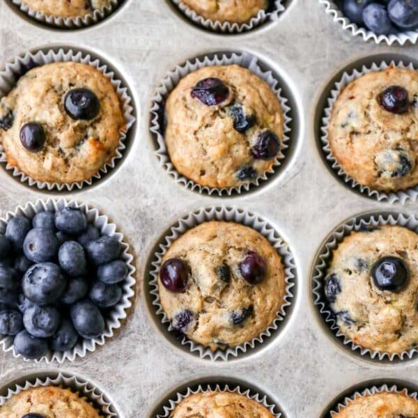 Blueberry banana muffins in a muffin pan.