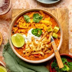 Chicken chili topped with tortilla strips, sour cream and lime.