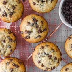 Chocolate chip banana muffins on a wire cooling rack.