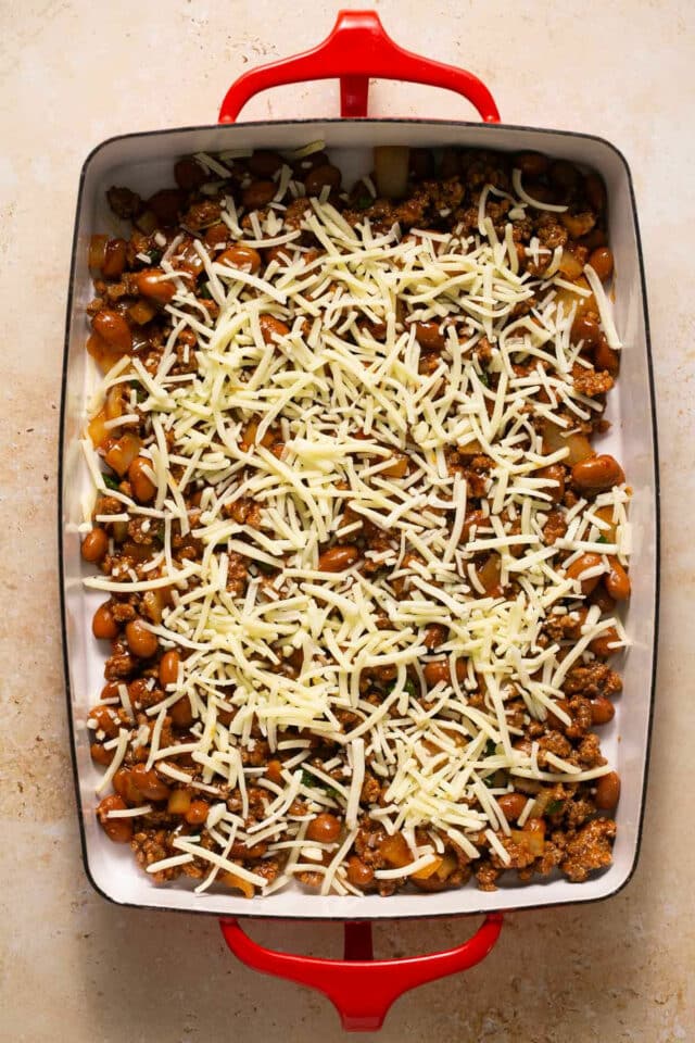 Top beef mixture with cheese.