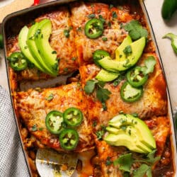 Enchilada casserole with one serving removed.