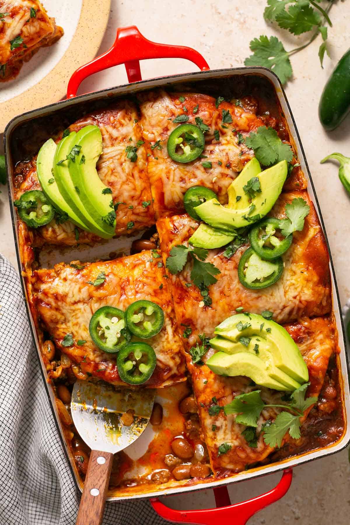 Enchilada casserole with one serving removed.