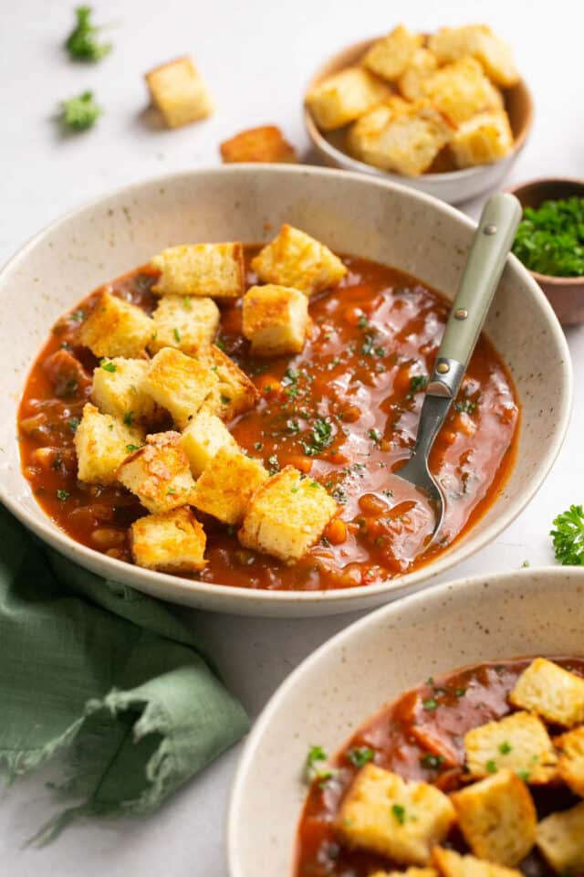 Garden vegetable soup topped with croutons.