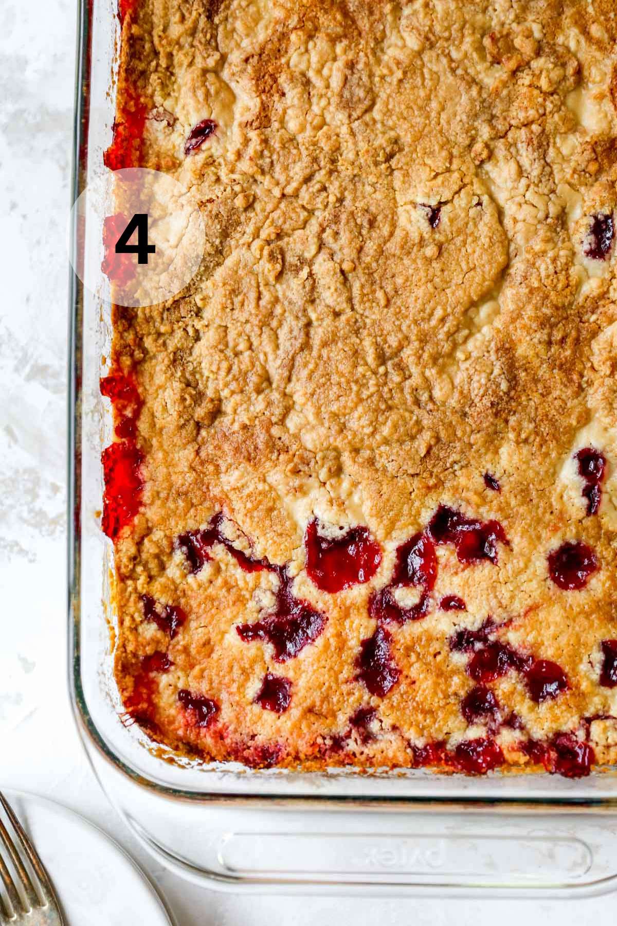 Baked cherry cobbler in a glass baking dish.
