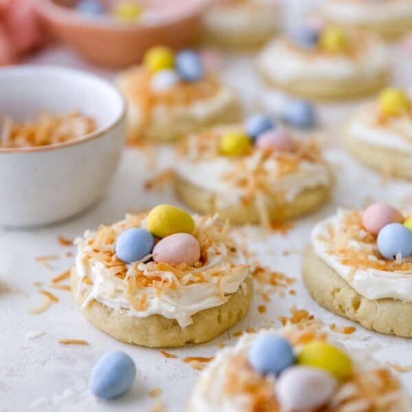 Bird's nest easter cookies with frosting, toasted coconut and mini Cadbury eggs.