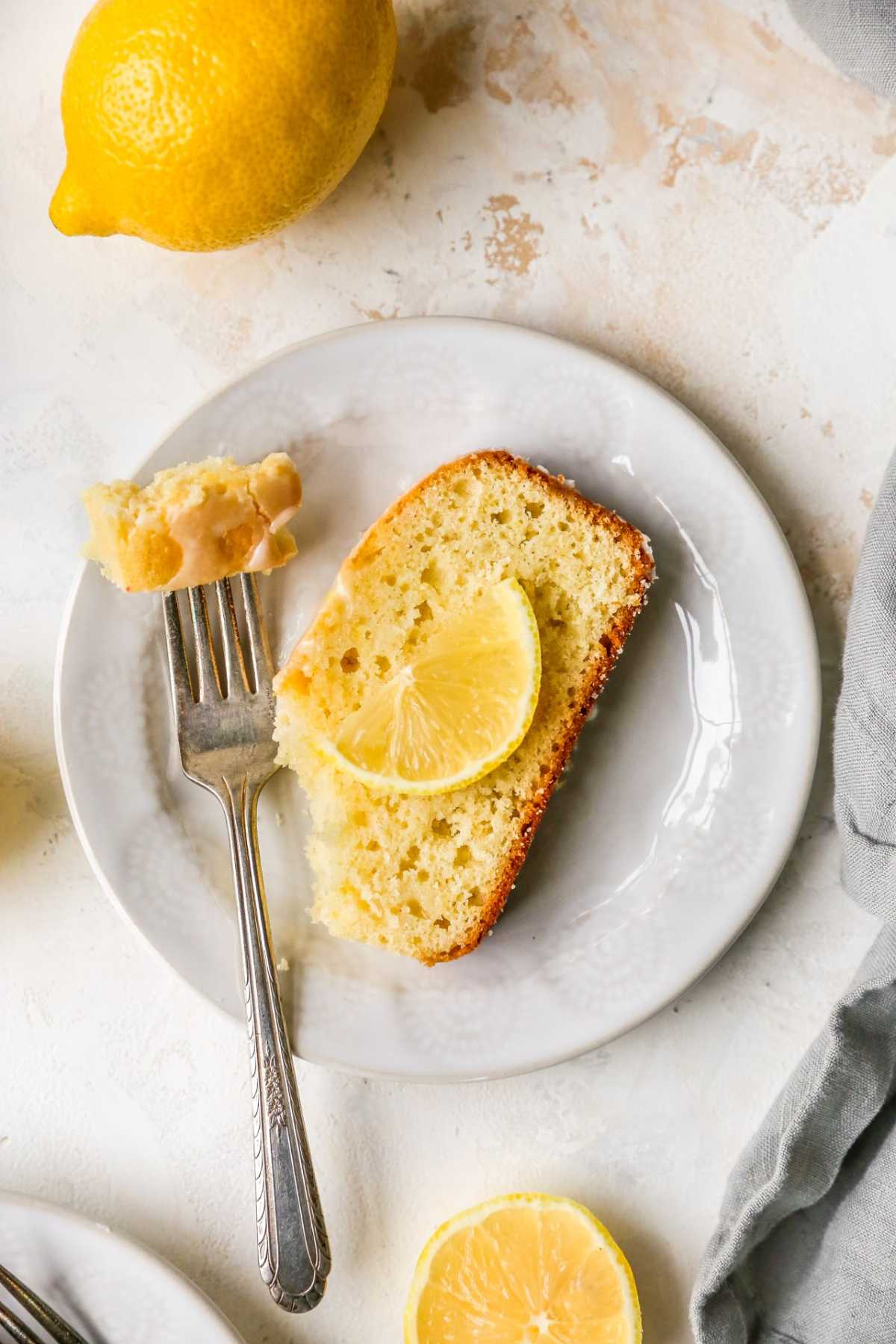 Bite of lemon bread on a fork.