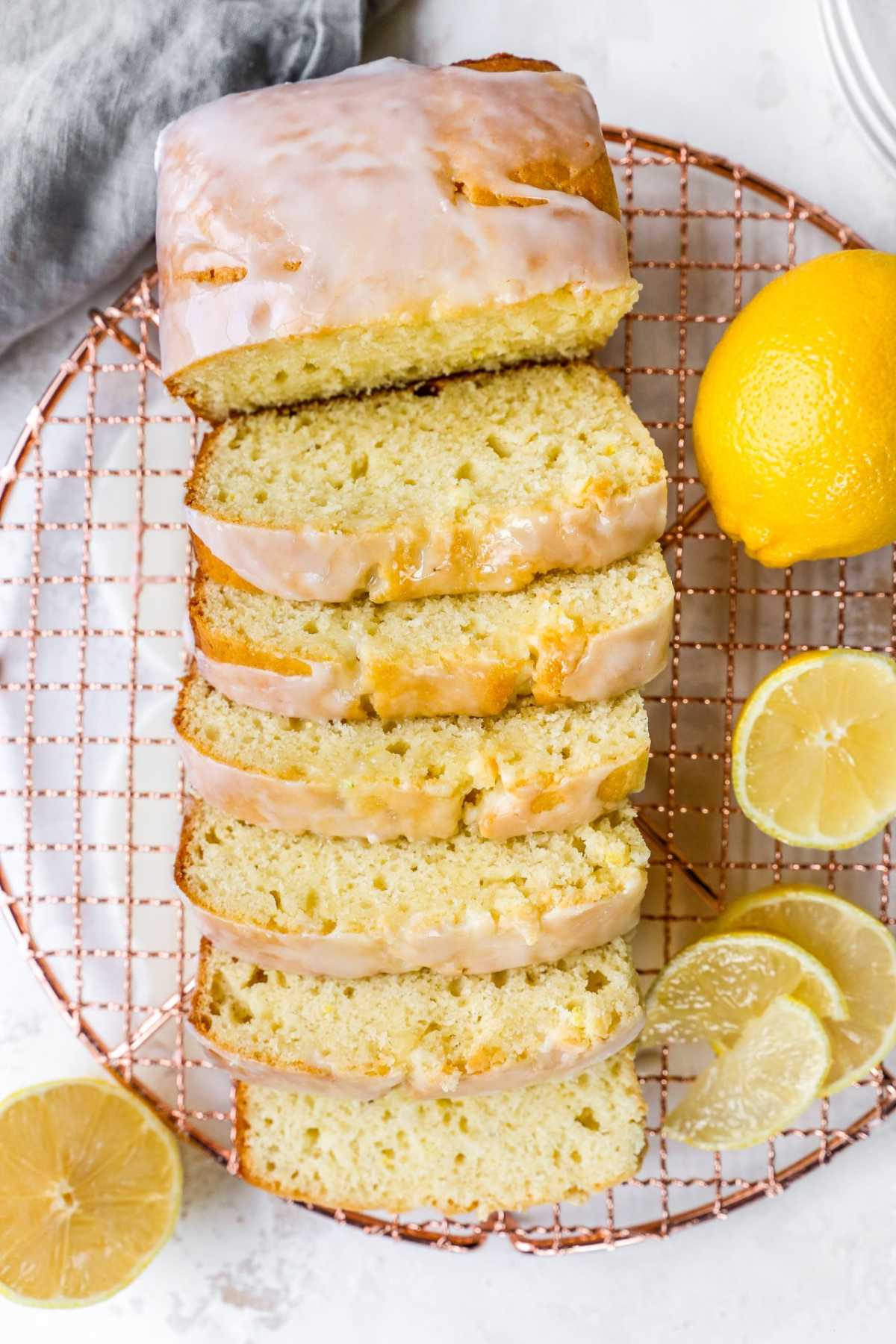 Slices of lemon loaf on a wire rack.