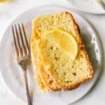 Slices of lemon pound cake garnished with a slice of lemon.