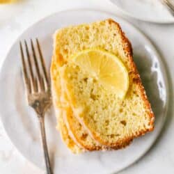 Slices of lemon pound cake garnished with a slice of lemon.