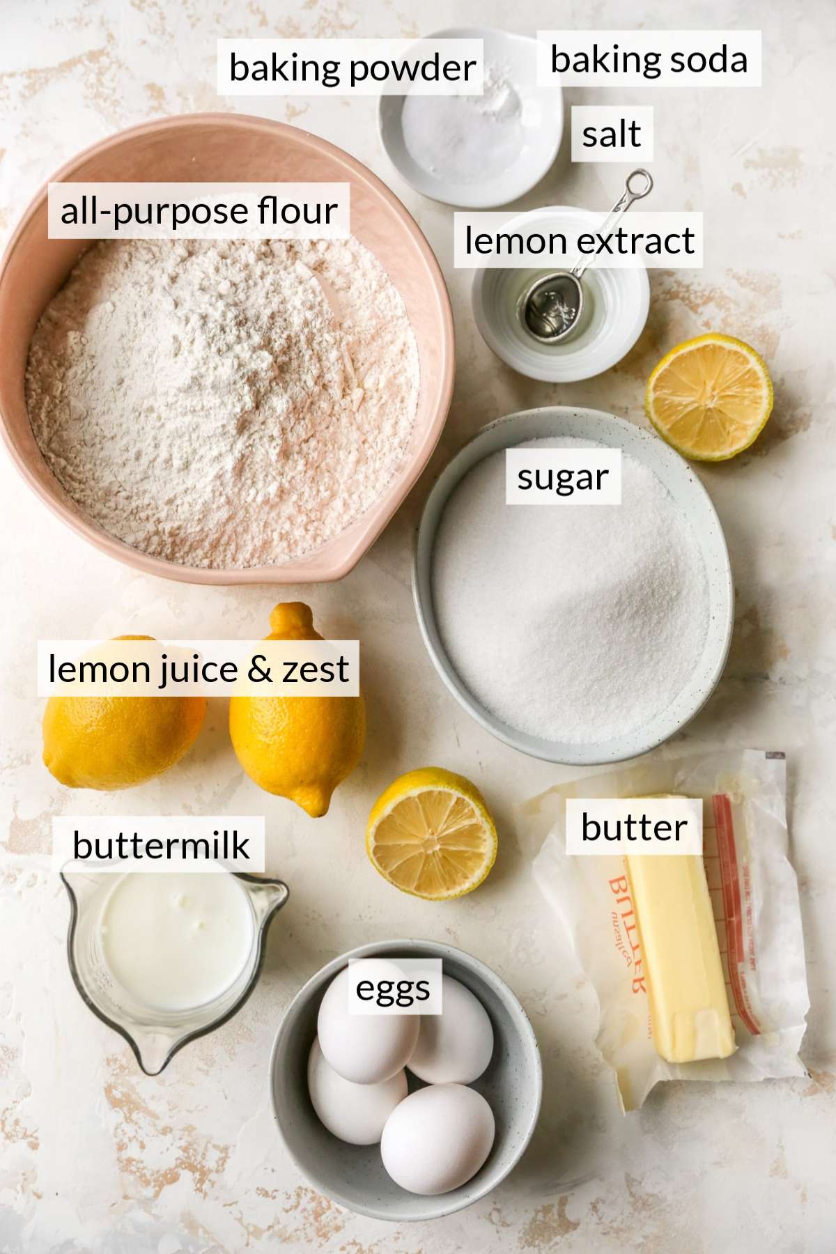 Flour, eggs, sugar, butter and lemons divided into small portions.