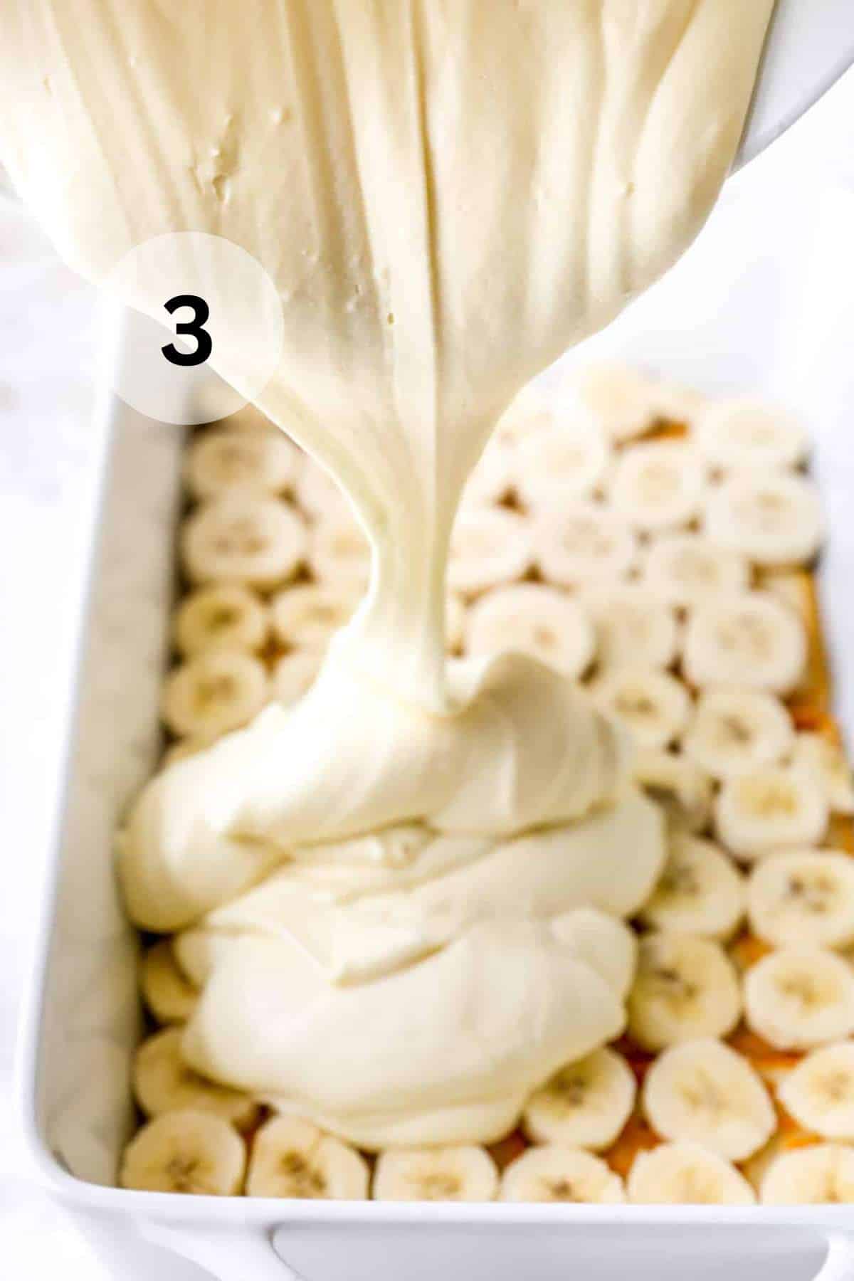 Pouring filling over cookies and banana slices.