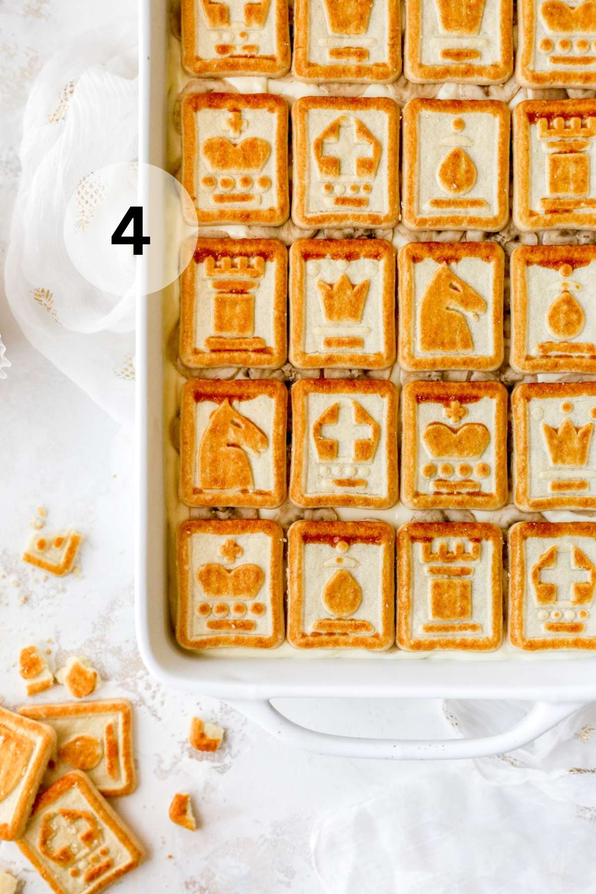 Banana pudding topped with banana slices and Chessman butter cookies.