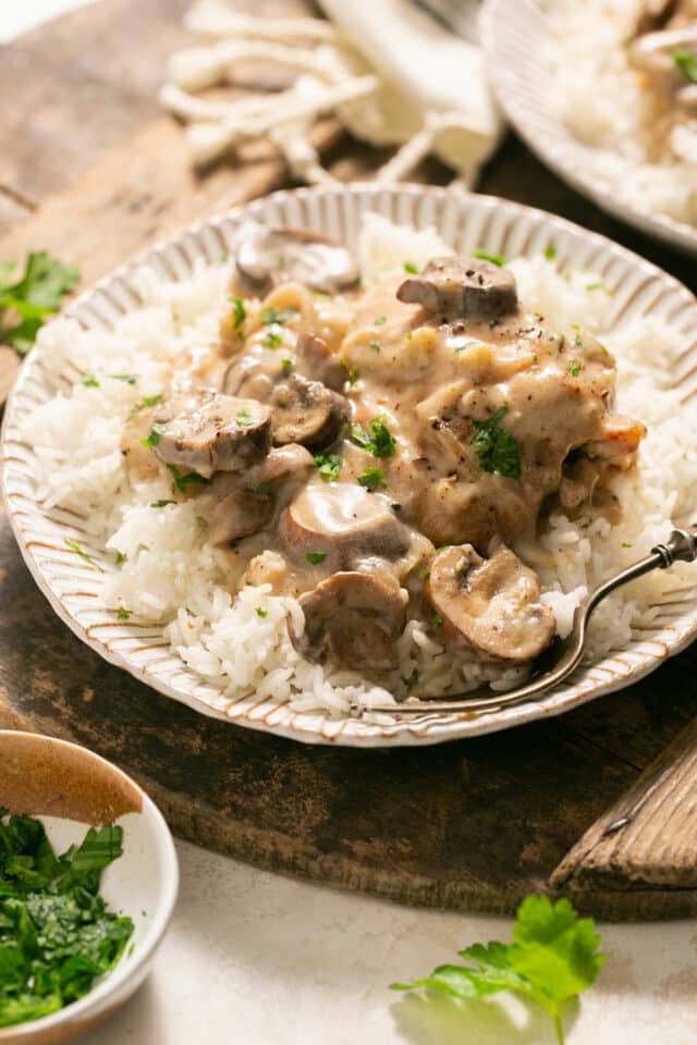 Mushroom chicken served over white rice.