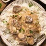 Chicken topped with a mushroom gravy served over white rice.