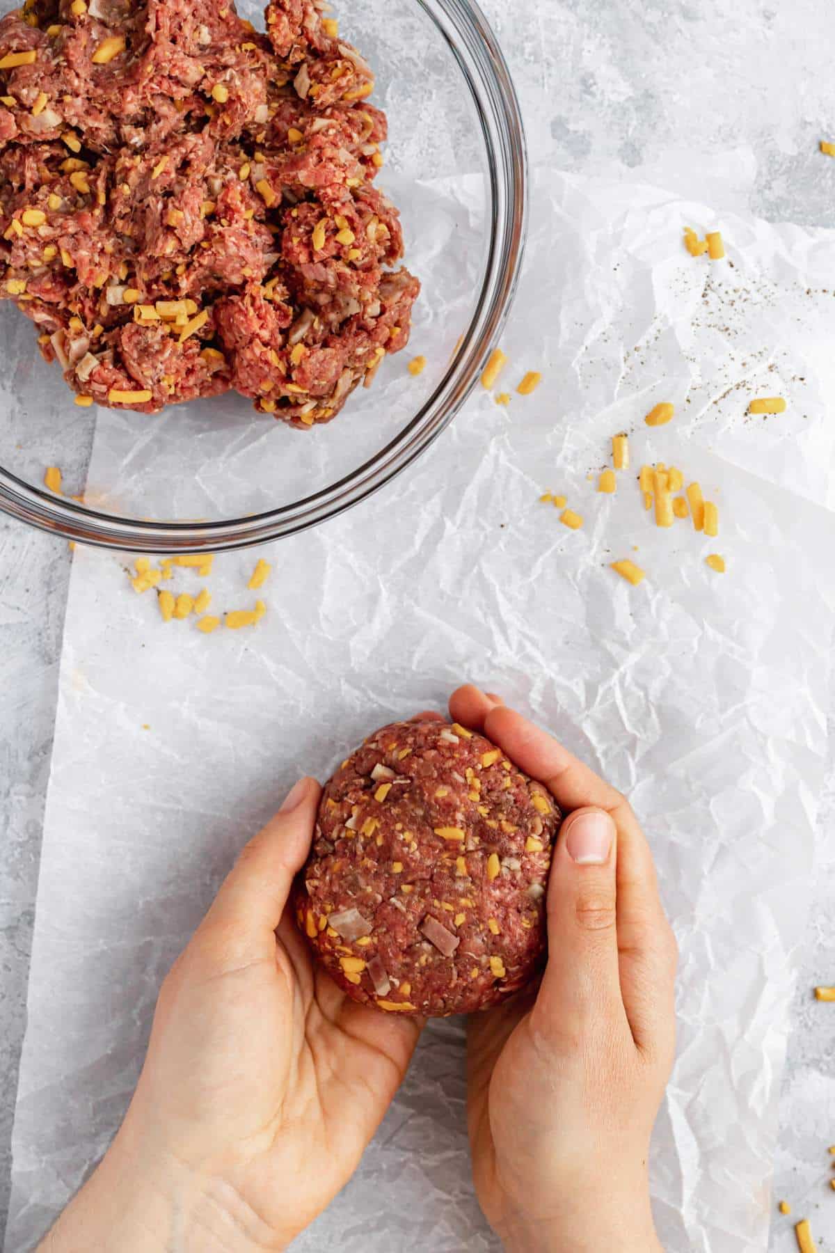 Forming beef into a burger patty.