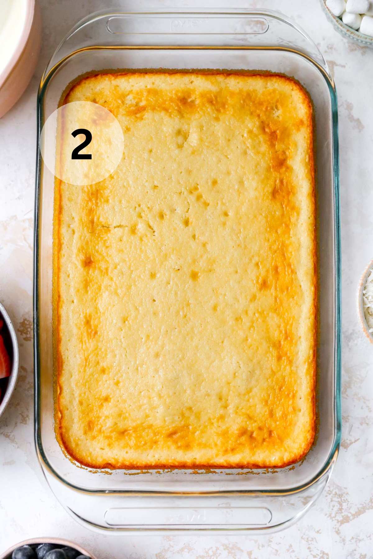 Baked yellow cake in a 9x13-inch pan.
