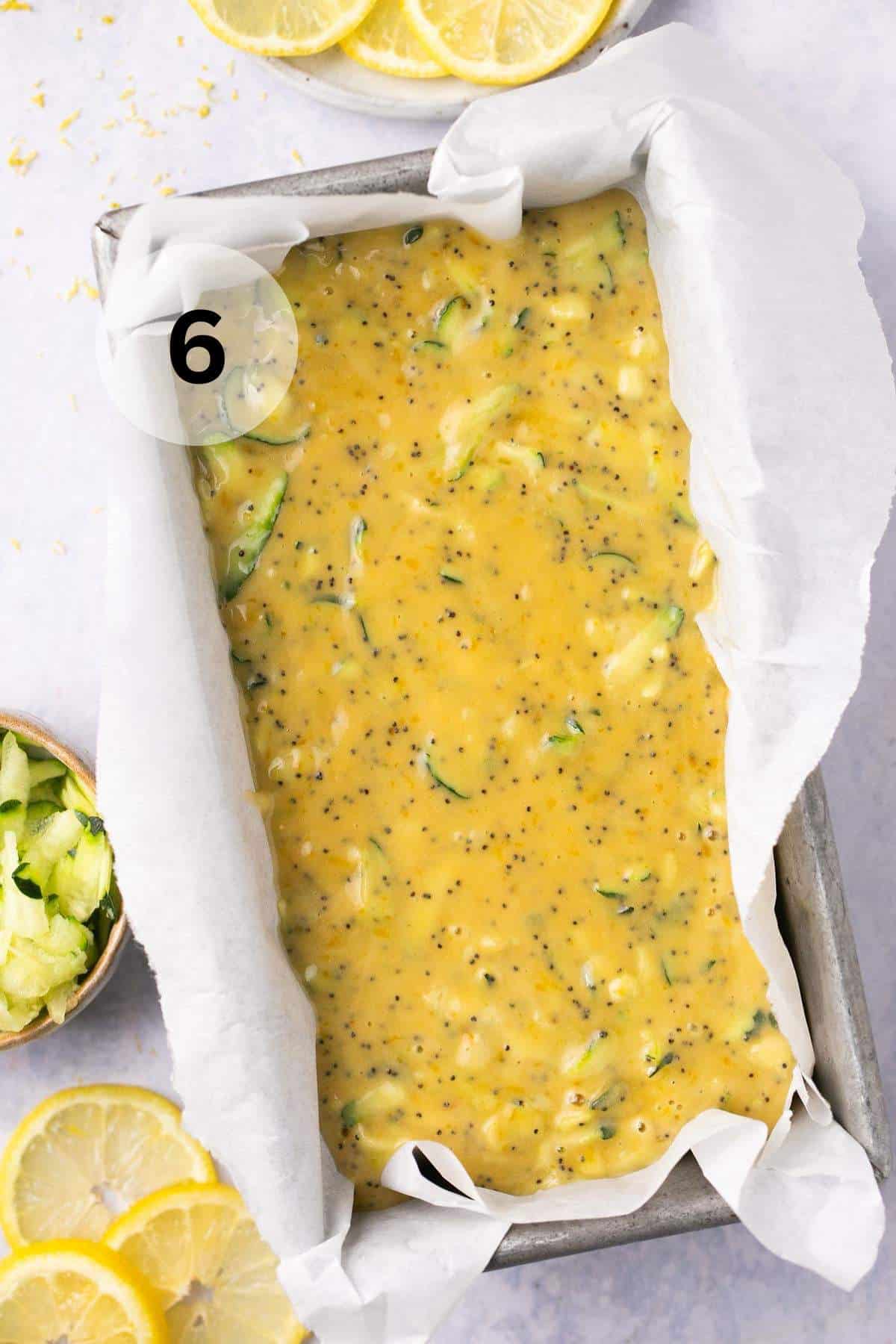 Lemon zucchini bread batter in a loaf pan.