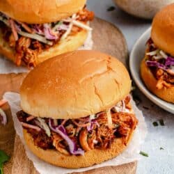 Slow cooker pulled chicken sandwiches with coleslaw.