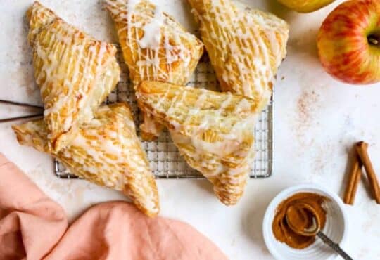Apple turnovers drizzled with a vanilla icing.