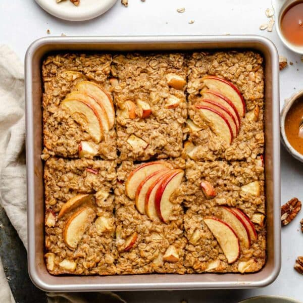 Baked oatmeal topped with apple slices.