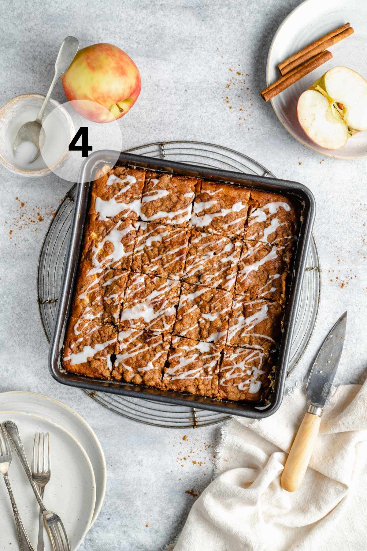 Apple coffee cake drizzled with glaze.